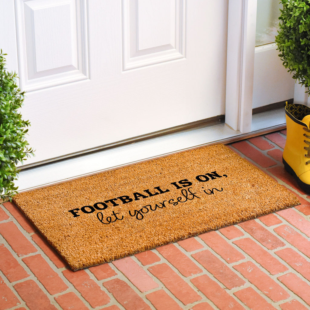 Football is on Let Yourself in Doormat Calloway Mills 